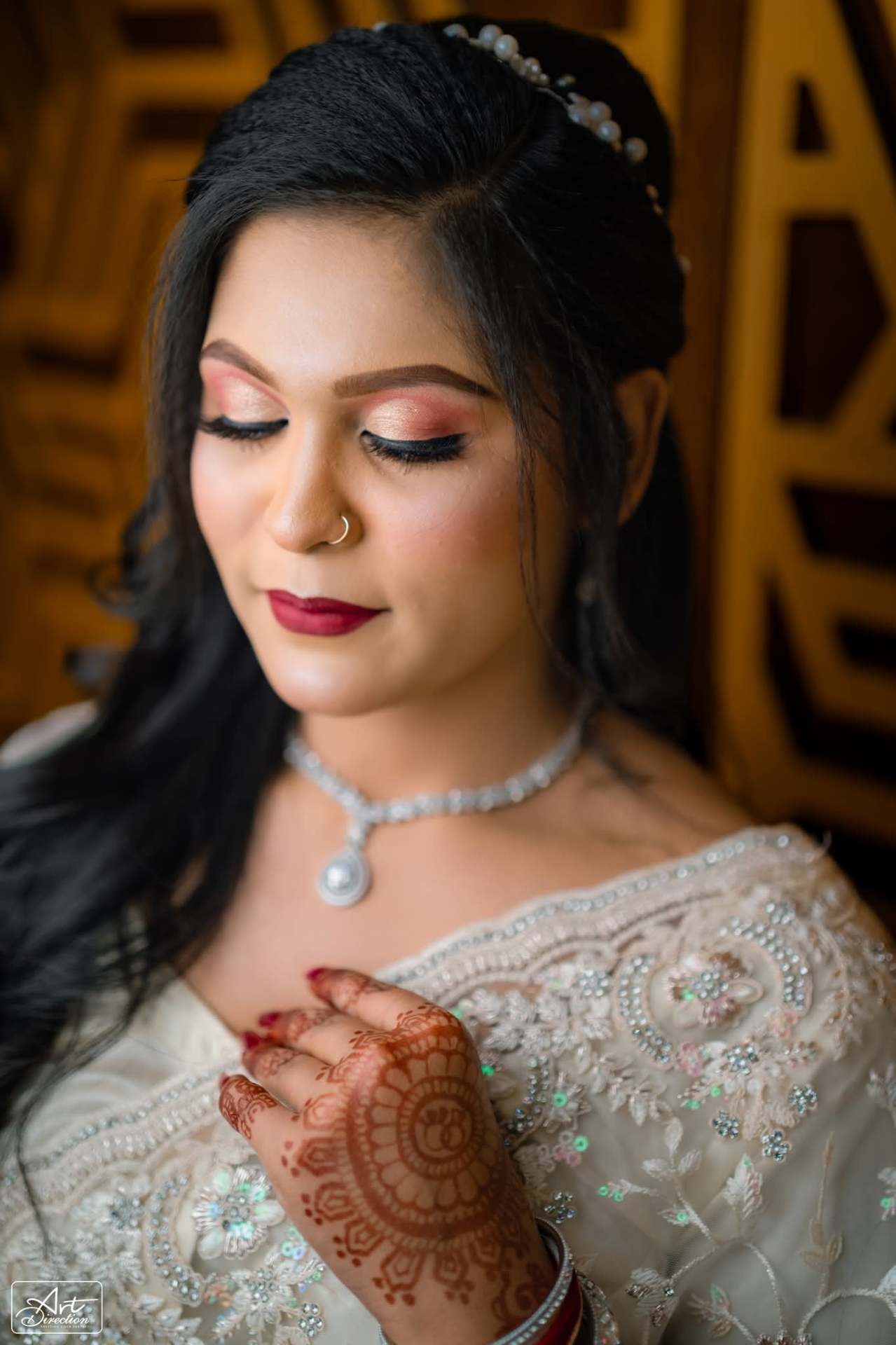 Close detail of bridal makeup and mehndi